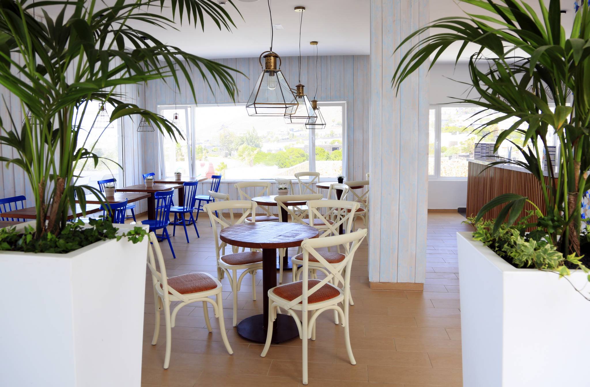 Interior of dining setup in the lobby bar at Alyssa Suite Hotel