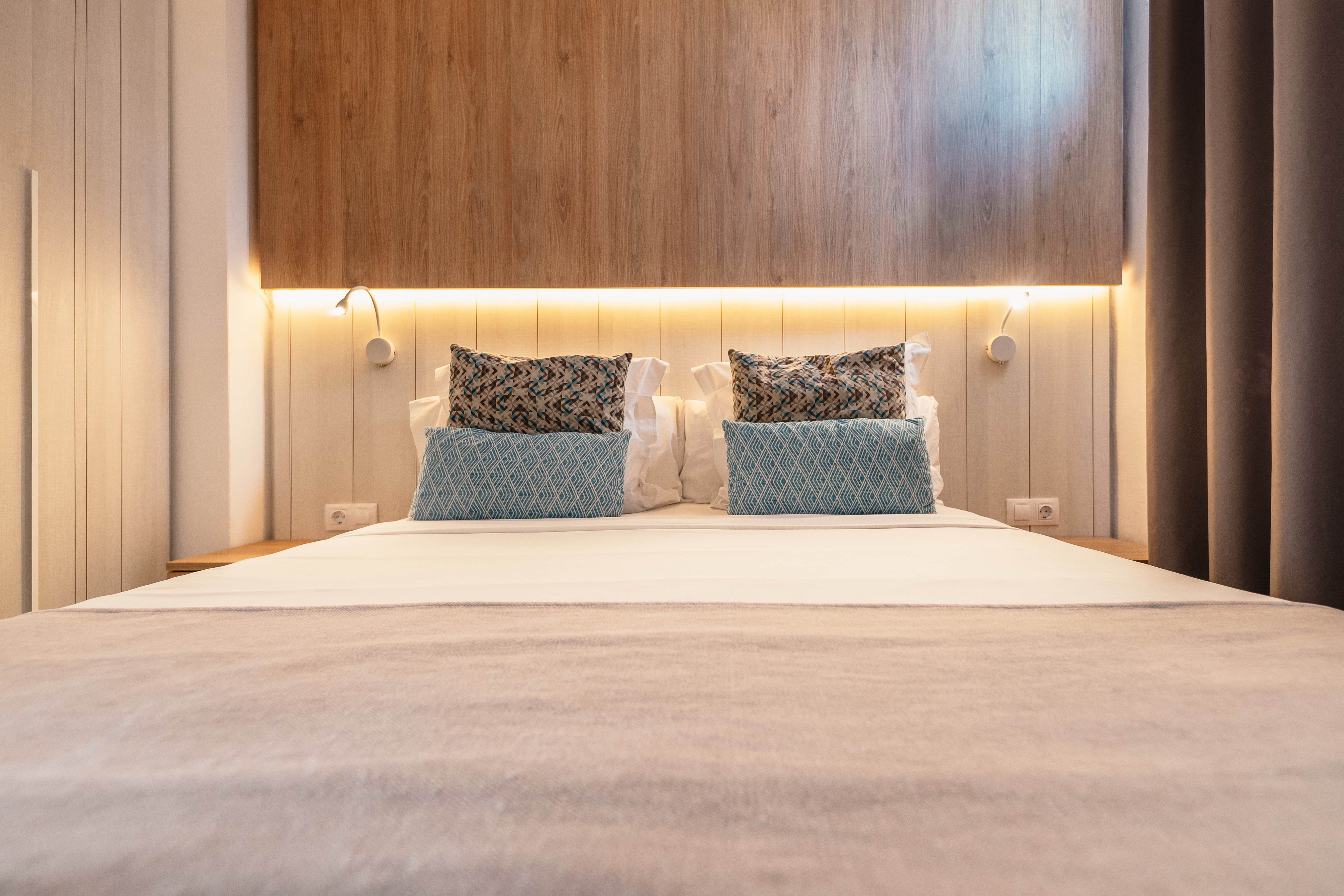 Bed & furniture in 1 Bedroom Suites at Alyssa Suite Hotel